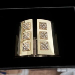 Victoria's Secret gold color-studded cuff bracelet.